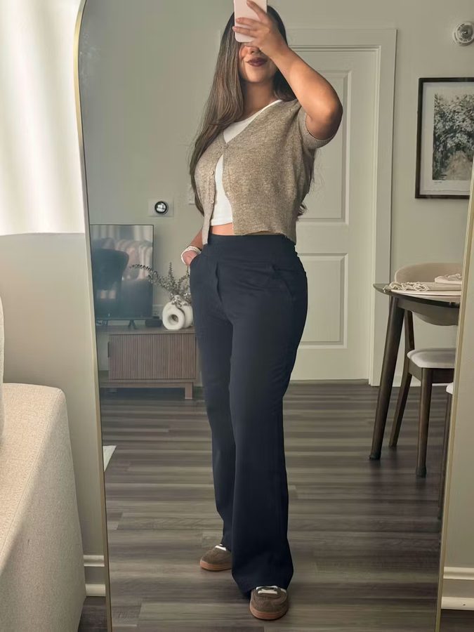 Customer mirror selfie — black wide-leg paired with beige cardigan