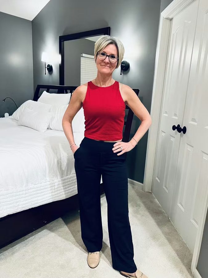 Customer with red tank top and black wide-leg pants